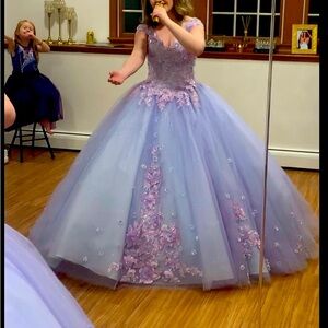 Beautiful lilac stoned quinceanera style dress is absolutely stunning.